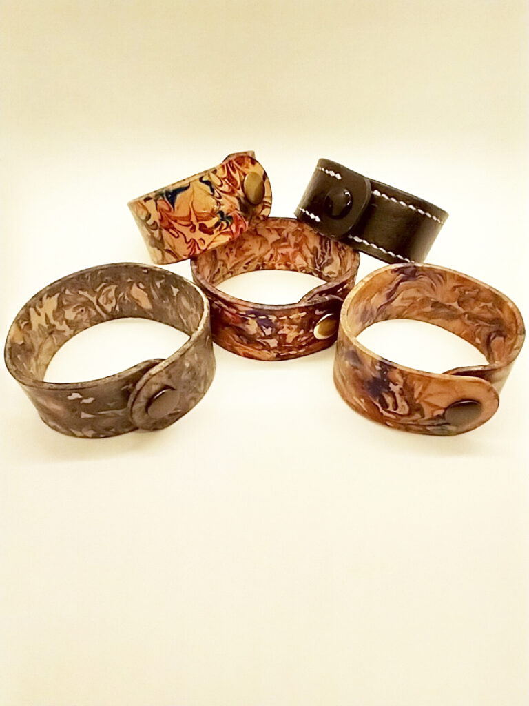 five marbled wrist bands
